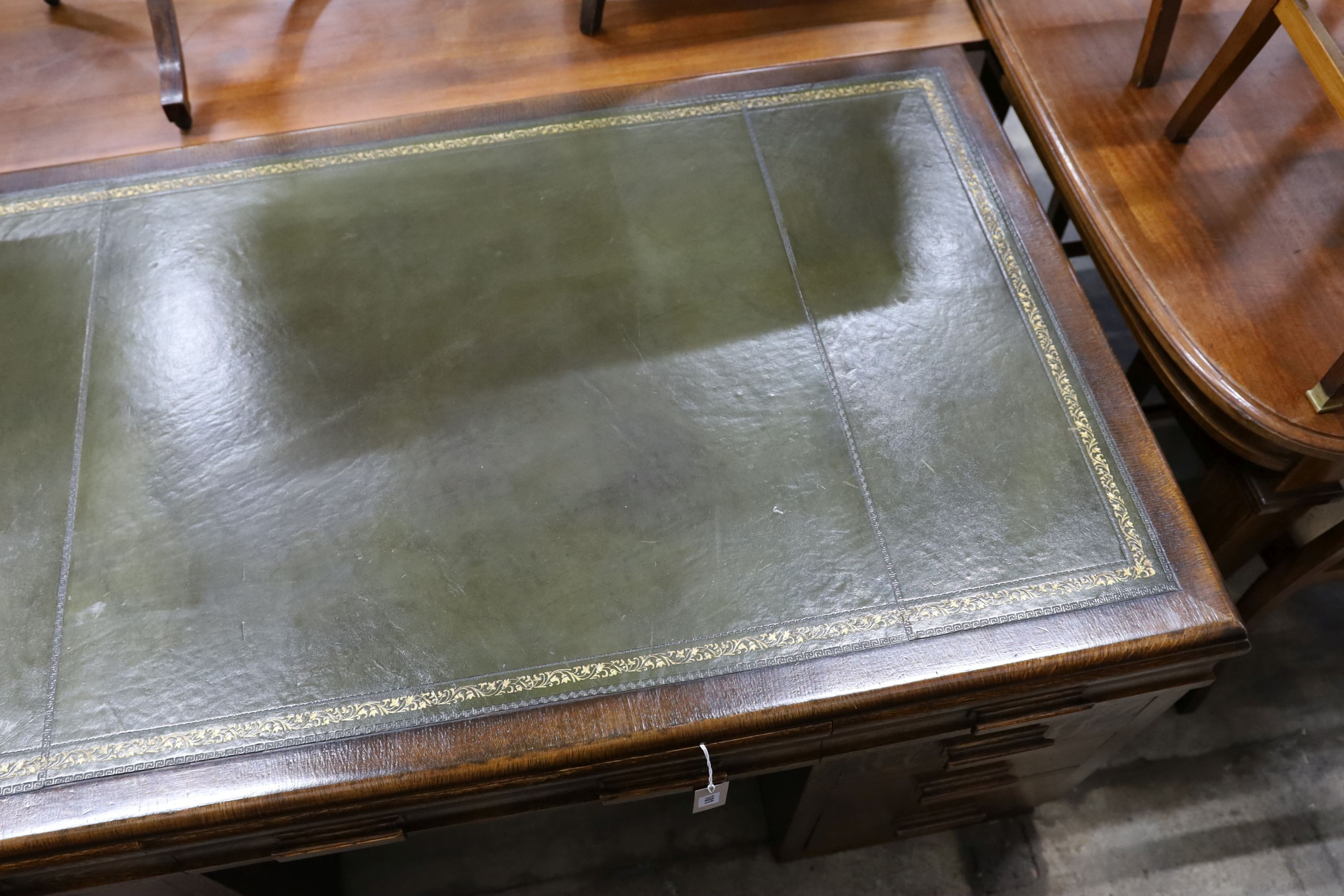 An early 20th century oak pedestal desk, length 152cm, depth 90cm, height 78cm